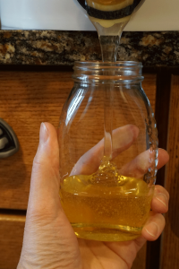 Filling honey jar